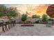Spacious backyard with a built-in bar, comfortable seating around a fire pit, and desert landscaping at 13583 S 177Th Ln, Goodyear, AZ 85338