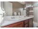 Bathroom with double vanity and framed mirror at 13583 S 177Th Ln, Goodyear, AZ 85338