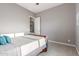 Spacious bedroom with a comfortable bed, neutral colors, and a ceiling fan for added comfort and style at 13583 S 177Th Ln, Goodyear, AZ 85338