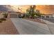 Lovely home exterior featuring desert landscaping, a wide driveway, and an attached two-car garage at 13583 S 177Th Ln, Goodyear, AZ 85338