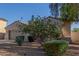 A charming home features lovely landscaping, a two-car garage, and an inviting entrance at 13583 S 177Th Ln, Goodyear, AZ 85338