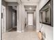 Inviting foyer featuring neutral walls, tile floors, and decorative niches, creating a welcoming entrance at 13583 S 177Th Ln, Goodyear, AZ 85338