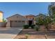Inviting single-story home with desert landscaping, large two-car garage and tile roof at 13583 S 177Th Ln, Goodyear, AZ 85338