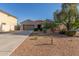 Well-maintained single-story home with desert landscaping and a two-car garage at 13583 S 177Th Ln, Goodyear, AZ 85338
