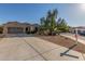 Charming home exterior with a well-manicured lawn, mature trees, and a spacious driveway for ample parking at 13583 S 177Th Ln, Goodyear, AZ 85338