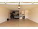 Spacious garage with epoxy flooring, providing functionality and cleanliness at 13583 S 177Th Ln, Goodyear, AZ 85338