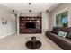 Spacious living room featuring a built-in media center, cozy sofa, and a sleek coffee table at 13583 S 177Th Ln, Goodyear, AZ 85338