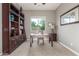 This office features a desk, bookshelf, and a window with a view of the backyard at 13583 S 177Th Ln, Goodyear, AZ 85338