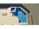 Overhead view of a sparkling backyard pool and attached spa with stone features at 13583 S 177Th Ln, Goodyear, AZ 85338