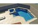 A beautiful pool and attached spa with stone accents and a water feature at 13583 S 177Th Ln, Goodyear, AZ 85338