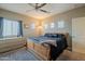 Bedroom featuring a ceiling fan, natural light, and neutral-toned walls at 1367 S Country Club Dr # 1127, Mesa, AZ 85210