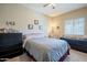 Comfortable bedroom with soft lighting, neutral walls, and dual dressers at 1367 S Country Club Dr # 1127, Mesa, AZ 85210