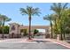 A gated community entrance with well-maintained landscaping and palm trees, ensuring privacy and security at 1367 S Country Club Dr # 1127, Mesa, AZ 85210