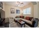 Relax in the living room with a plush sectional, and large window providing natural light at 1367 S Country Club Dr # 1127, Mesa, AZ 85210