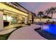 Beautiful pool in backyard, with an outdoor seating area under a covered patio at 1429 E Lowell Ave, Gilbert, AZ 85295