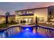 Backyard with a pool, well-manicured lawn, and string lights creating a relaxing atmosphere at 1429 E Lowell Ave, Gilbert, AZ 85295