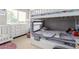 Well-lit bedroom includes a bunk bed and white dresser at 1429 E Lowell Ave, Gilbert, AZ 85295