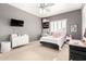 This bedroom includes a desk, vanity, stuffed animals, and shelving at 1429 E Lowell Ave, Gilbert, AZ 85295