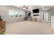 Spacious bonus room with carpet, lots of natural light, and ceiling fan at 1429 E Lowell Ave, Gilbert, AZ 85295