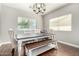 Inviting dining room with natural light, table with chairs, and bench seating at 1429 E Lowell Ave, Gilbert, AZ 85295