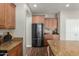 Well-lit kitchen features wood cabinets, stainless steel appliances, and granite counters at 1429 E Lowell Ave, Gilbert, AZ 85295