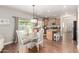 Eat-in kitchen featuring stainless appliances, granite counters, and a sliding glass door at 1429 E Lowell Ave, Gilbert, AZ 85295