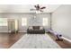 Living room with hardwood floors, a cozy sofa, and natural light from the windows at 1429 E Lowell Ave, Gilbert, AZ 85295