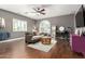 Comfortable living room featuring hardwood floors, a ceiling fan, and stylish decor at 1429 E Lowell Ave, Gilbert, AZ 85295