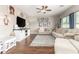 Living room featuring hardwood floors, neutral tones, comfortable seating, and TV at 1429 E Lowell Ave, Gilbert, AZ 85295
