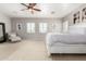 This relaxing main bedroom features plantation shutters and a ceiling fan at 1429 E Lowell Ave, Gilbert, AZ 85295