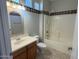 Bathroom features a sink, mirror, and bathtub at 15801 W Goldenrod Dr, Surprise, AZ 85374