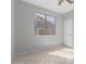 Bedroom featuring tile floors, ceiling fan, and a large window at 15801 W Goldenrod Dr, Surprise, AZ 85374