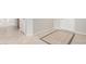 Light and airy entryway featuring neutral tile flooring with decorative tile insert and white trim at 15801 W Goldenrod Dr, Surprise, AZ 85374