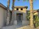 Front entry of the home showing a secure screen door and desert landscaping at 15801 W Goldenrod Dr, Surprise, AZ 85374