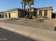 Charming single-story home with a low maintenance desert landscape and a three car garage at 15801 W Goldenrod Dr, Surprise, AZ 85374