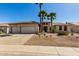 Inviting single-story home featuring desert landscaping, a spacious driveway, and charming curb appeal at 15801 W Goldenrod Dr, Surprise, AZ 85374