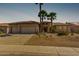 Inviting single-story home featuring desert landscaping, a spacious driveway, and charming curb appeal at 15801 W Goldenrod Dr, Surprise, AZ 85374