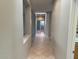 Hallway with large open windows bringing natural light to the home at 15801 W Goldenrod Dr, Surprise, AZ 85374