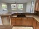 Kitchen with stainless steel dishwasher, large sink, and breakfast bar at 15801 W Goldenrod Dr, Surprise, AZ 85374