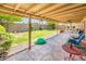 Large backyard with a covered patio, lush green lawn, and ample space for outdoor activities at 16425 N 46Th Dr, Glendale, AZ 85306