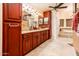 Bathroom featuring & sinks, tiled floors, and a separate bathtub at 16425 N 46Th Dr, Glendale, AZ 85306