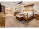 Cozy bedroom with wood accents, floral wallpaper, and natural light at 16425 N 46Th Dr, Glendale, AZ 85306
