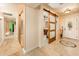 Well-lit entryway showcases tile floors and a stylish sliding barn door enhancing the home's character at 16425 N 46Th Dr, Glendale, AZ 85306