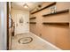 Inviting foyer featuring decorative tile flooring and custom wood shelving, offering a warm welcome at 16425 N 46Th Dr, Glendale, AZ 85306