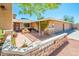 Cozy courtyard with brick accents, potted plants, and a charming entrance leading into the home at 16425 N 46Th Dr, Glendale, AZ 85306
