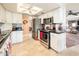 Updated kitchen with granite countertops, stainless steel appliances, and tiled floor at 16425 N 46Th Dr, Glendale, AZ 85306