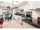 Eat-in kitchen features white cabinetry, updated countertops, and stainless steel appliances at 16425 N 46Th Dr, Glendale, AZ 85306