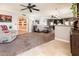 Spacious living room with plush carpeting, neutral decor, and an inviting open floor plan at 16425 N 46Th Dr, Glendale, AZ 85306