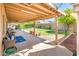 Spacious covered patio overlooking the well manicured green backyard at 16425 N 46Th Dr, Glendale, AZ 85306