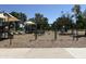 Well-equipped playground featuring various play structures, swings, and slides, covered by shade canopies at 16425 N 46Th Dr, Glendale, AZ 85306